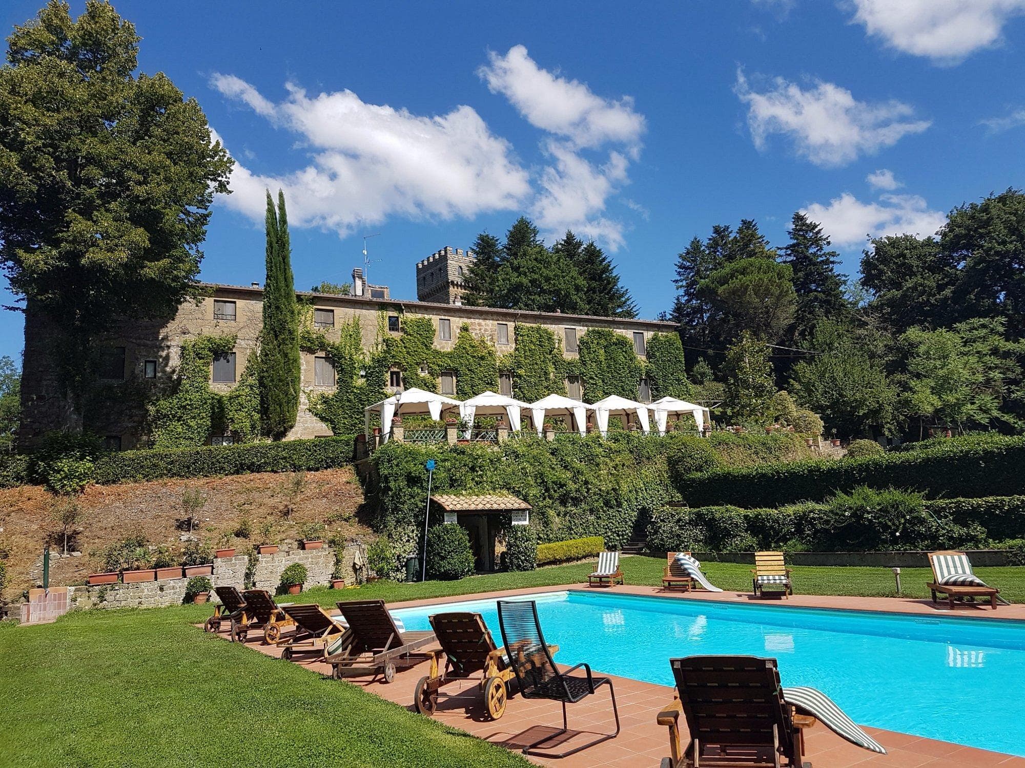 The Italian castle estate where the Welcome Pilates retreat is held, with a terrace and pool